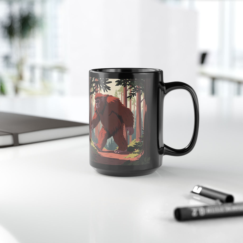 Bigfoot Forest Mug — 15oz Black Coffee Cup with Sasquatch Woodland Illustration